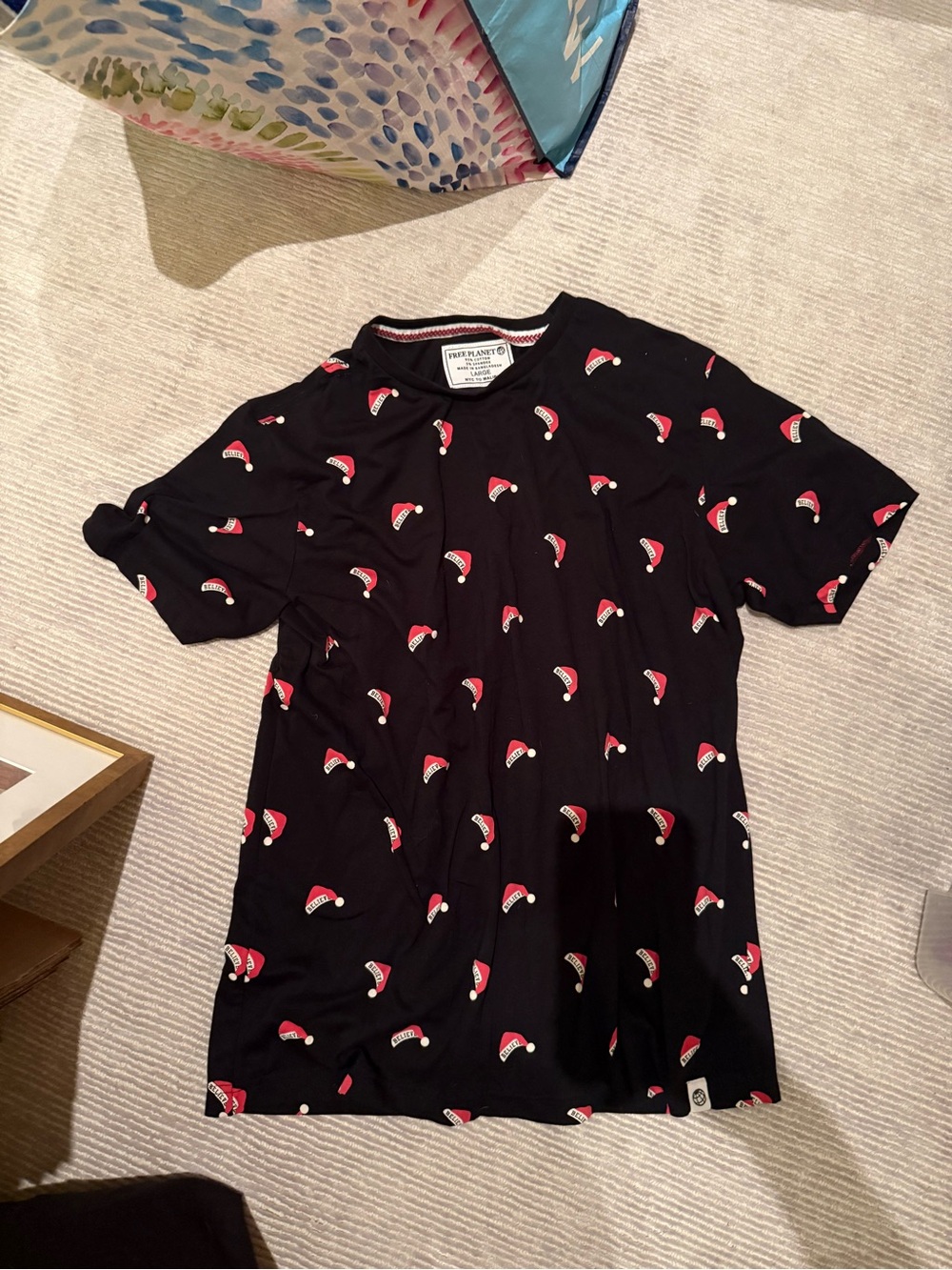 Free Planet Black Tee with White Brand Label